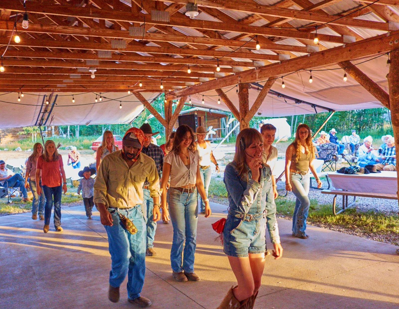 Line dance lesson under the pavilion